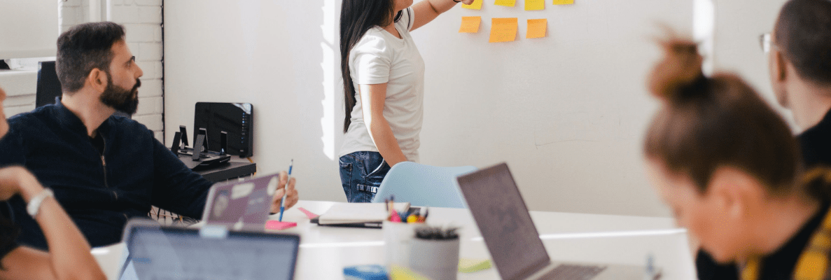 A team working on a whiteboard